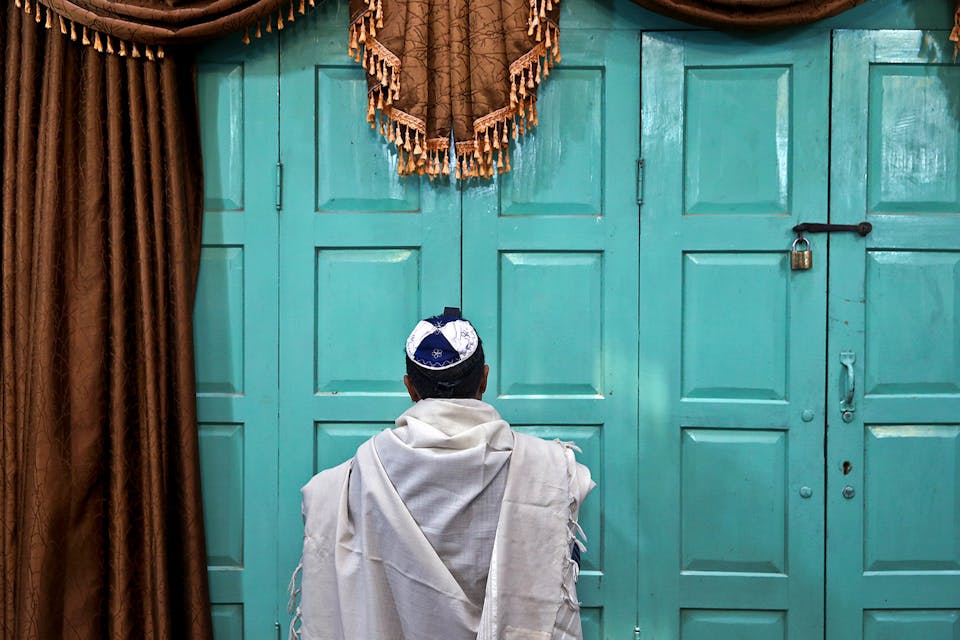 *An Iranian Jewish man prays at the Molla Agha Baba Synagogue in the city of Yazd 420 miles south of capital Tehran. *AP Photo/Ebrahim Noroozi. Jews Iran Main