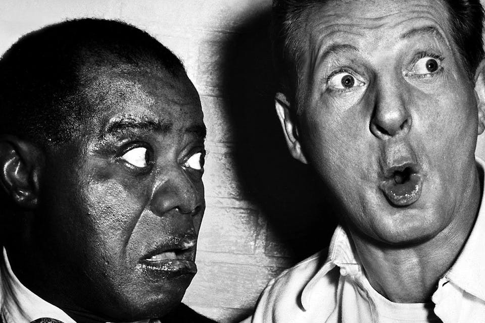 *Louis Armstrong and Danny Kaye making a tararam in *The Five Pennies*, 1959.* PARAMOUNT PICTURES and A.F. ARCHIVE. Kaye Arm