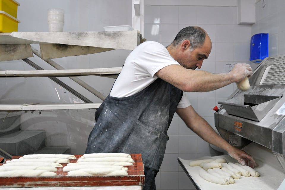 *Russell, the proprietor of Russell's Bakery in Jerusalem, at work. *Flash90/Sophie Gordon. Russell Bakery m
