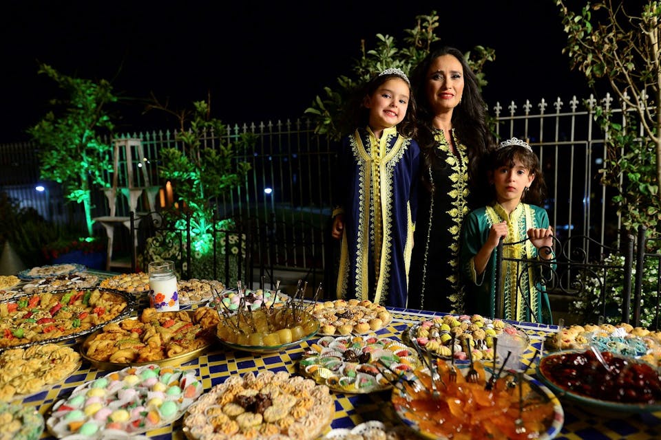 *An Israeli woman and her children at the post-Passover festival of Mimouna, a North African Jewish tradition that is now a de-facto national celebration.* Flash90. mimounamain