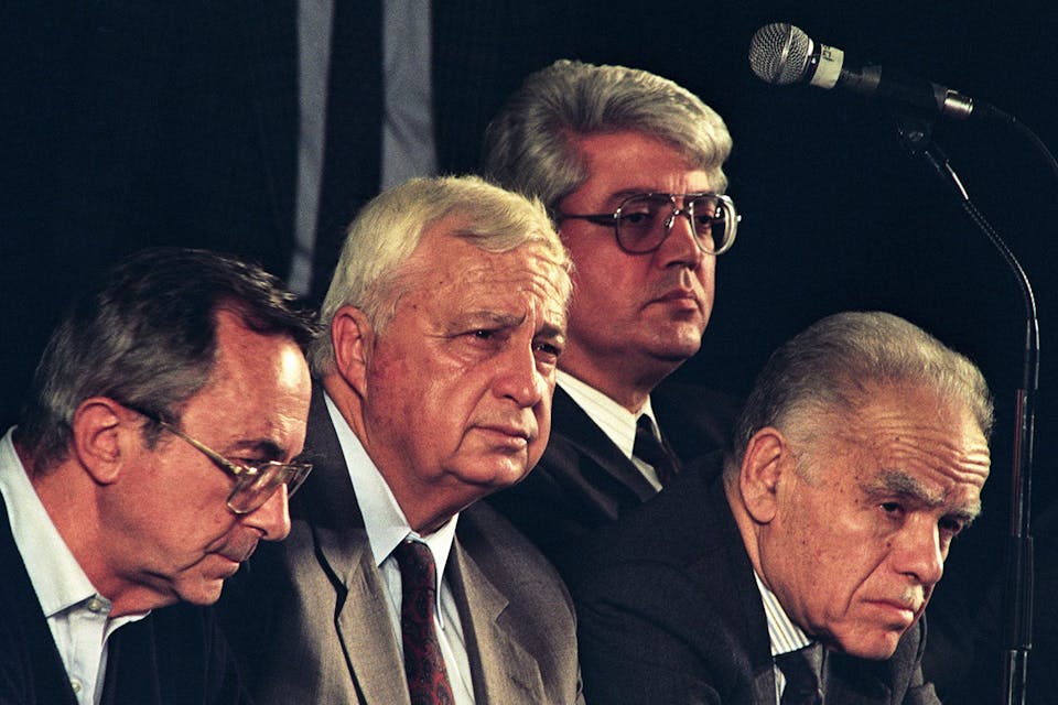 *Moshe Arens (left), with Ariel Sharon, David Levy, and Yitzhak Shamir on February 10, 1992 in Israel.* Esaias BAITEL/Gamma-Rapho via Getty Images. Arens Main