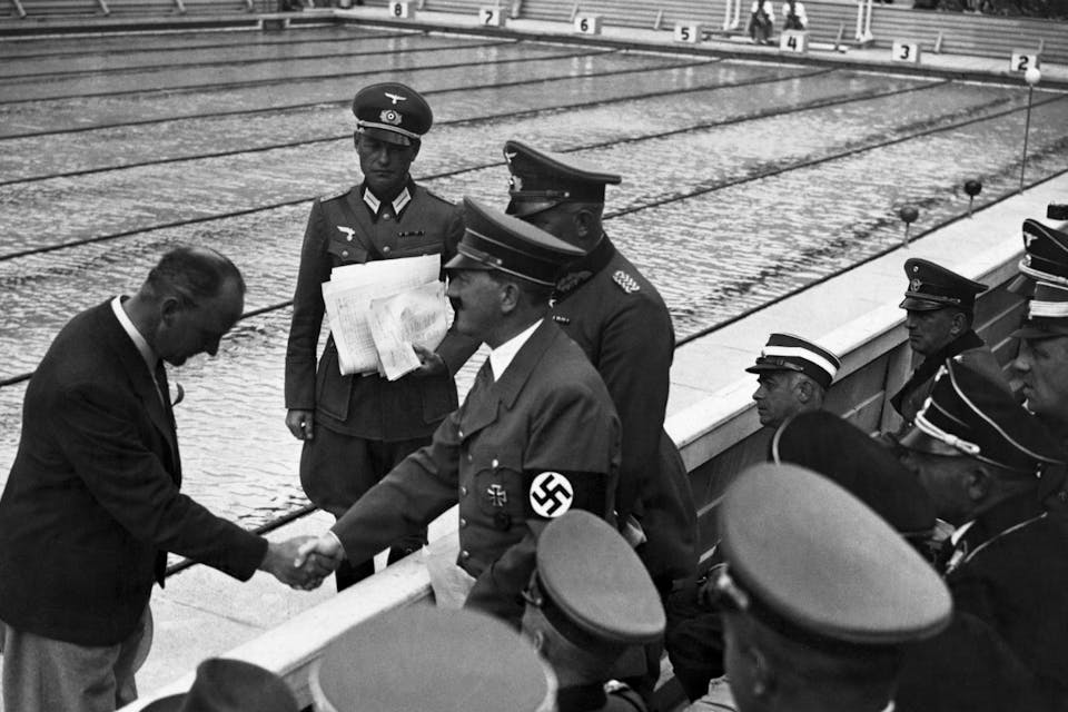 *Adolf Hitler at the 1936 Olympic Games in Berlin.* Hulton-Deutsch Collection/CORBIS/Corbis via Getty Images. hitler pool main
