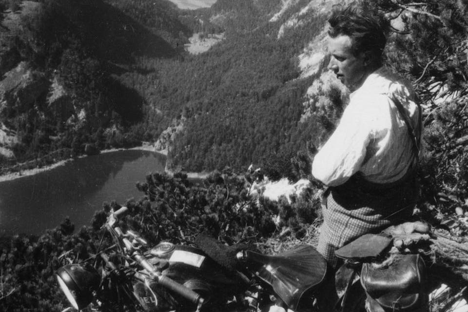 *A resting motorcyclist above the three Lakes Gosauer in Austria around 1935.* Imagno/Getty Images. Motorcyle-Mountains
