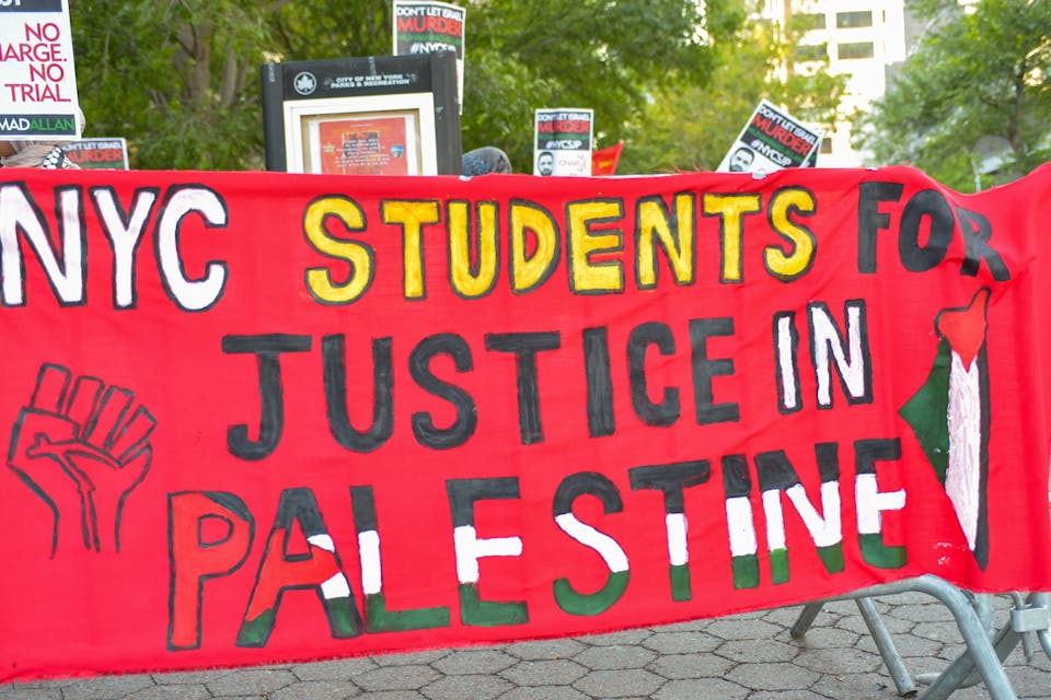 *A banner for Students for Justice in Palestine at a rally in New York in 2015.* Albin Lohr-Jones/Pacific Press/LightRocket via Getty Images. Suzi-Main