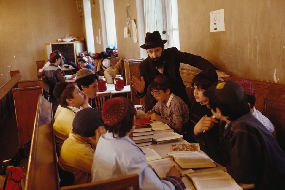 *A teacher of Hebrew at the Moscow Synagogue in 1990. *Steven L. Raymer/National Geographic/Getty Images. shrayer-main