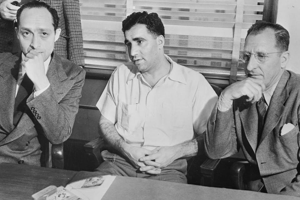 *New York Jewish gangsters Al Tannebaum and Abe "Kid Twist" Reles with District Attorney Burton Fitts in 1940.* Copyright Bettmann/Corbis/AP Images. Reles