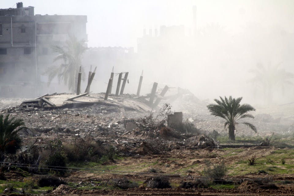 Smoke rises after Egyptian forces, in response to militant attacks, blow up a house in the border town of Rafah in November 2014. Egypt-Main