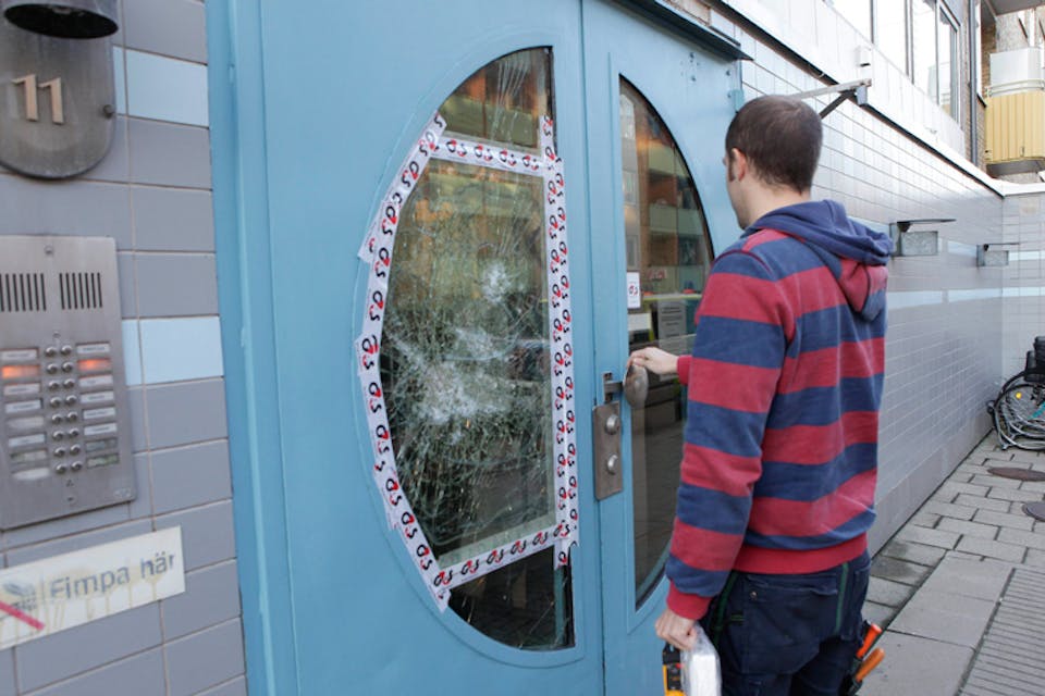 *In the wake of a nearby explosion, a man enters a Jewish community centre in Malmo, southern Sweden, in 2012.* DRAGO PRVULOVIC/AFP/GettyImages. Annika-Main