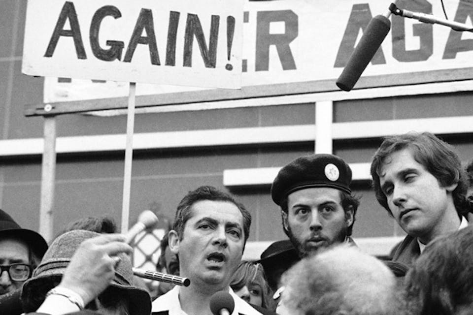 *Rabbi Meir Kahane, leader of the Jewish Defense League, stands in the midst of protestors in Washington, March 20, 1977.* AP Photo/Charles Tasnadi. Kahane-Main