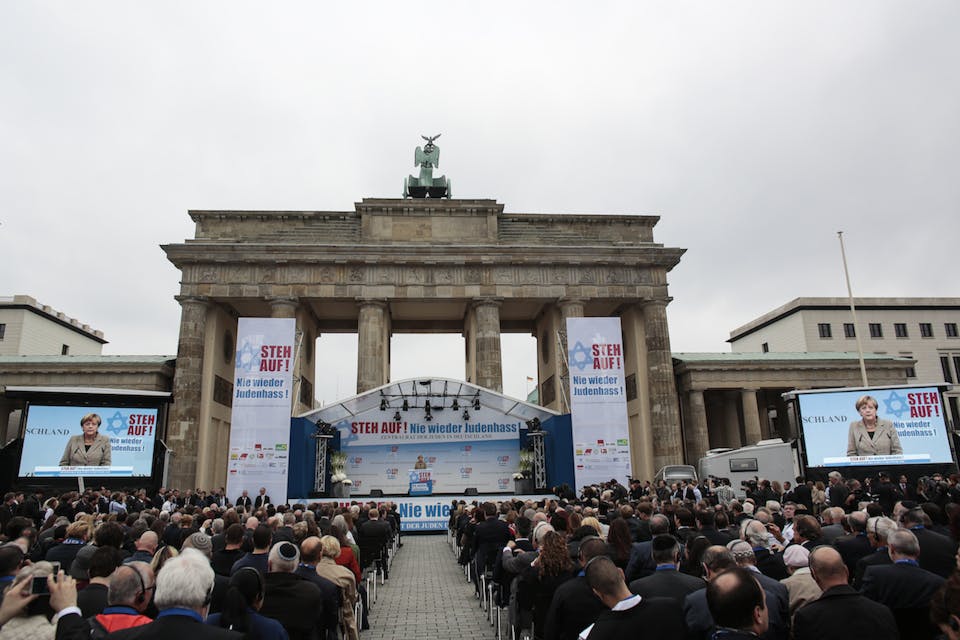 *German Chancellor Angela Merkel delivers her speech at a rally against anti-Semitism near the Brandenburg Gate in Berlin, Sept. 14, 2014.* Photo by Markus Schreiber/AP. merkelspeech
