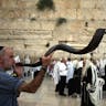 *A man blows the shofar in Jerusalem for Rosh Hashanah.* Photo by Awad Awada/Anadolu Agency/Getty Images. shofarroshhashanahsmall