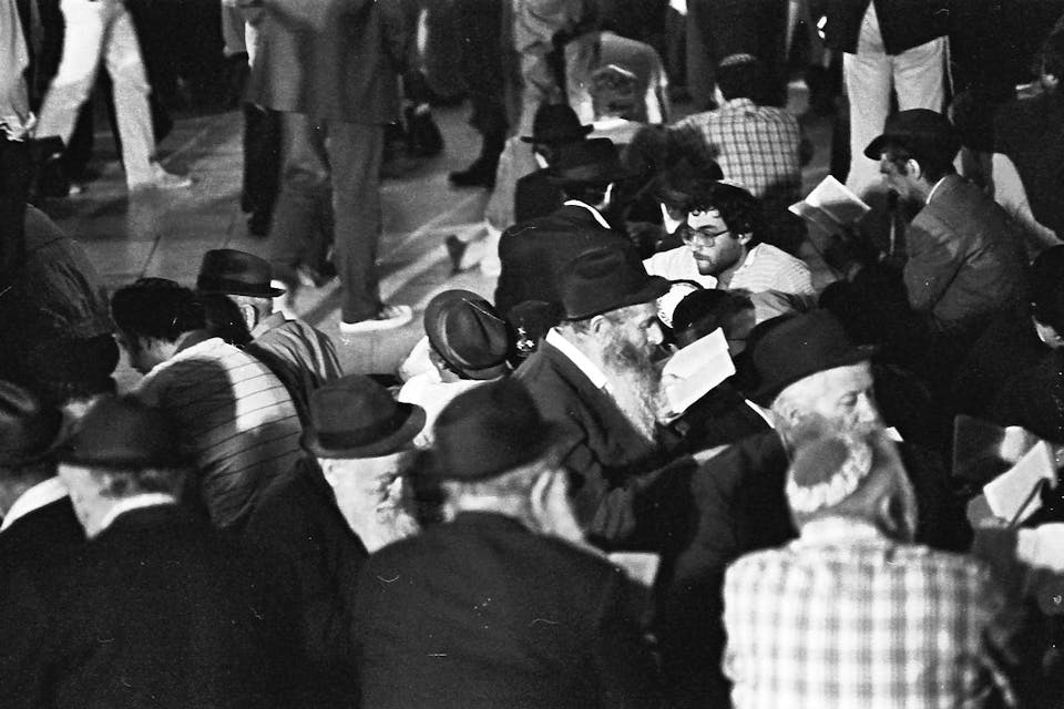 Men reading *kinnot *at the Western Wall some time between 1977 and 1981. *Saimi Gluck via Wikipedia*. PikiWiki_Israel_3434_9_av_kotel