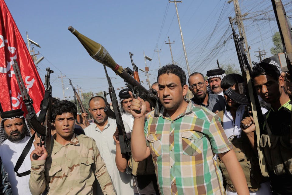 *Responding to a public call to arms against the Islamic State of Iraq and Syria, thousands of Iraqi Shiites spill out into the streets of Baghdad on June 27. *Photo by Stringer/Anadolu Agency/Getty Images. shiitesarmagainstisis
