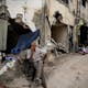 TOPSHOT – A man sits in front of a damaged building following an Israeli military raid in the Jenin refugee camp, in the occupied West Bank on September 6, 2024. Israeli forces withdrew from Jenin in the occupied West Bank on September 6 after a deadly 10-day operation, witnesses said, as Hamas blamed Israel for deadlock in Gaza truce talks. (Photo by RONALDO SCHEMIDT / AFP) (Photo by RONALDO SCHEMIDT/AFP via Getty Images)