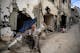 TOPSHOT – A man sits in front of a damaged building following an Israeli military raid in the Jenin refugee camp, in the occupied West Bank on September 6, 2024. Israeli forces withdrew from Jenin in the occupied West Bank on September 6 after a deadly 10-day operation, witnesses said, as Hamas blamed Israel for deadlock in Gaza truce talks. (Photo by RONALDO SCHEMIDT / AFP) (Photo by RONALDO SCHEMIDT/AFP via Getty Images)