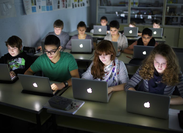 Pupils working at their laptops during a lesson at a German school on November 07, 2012. *Thomas Trutschel/Photothek via Getty Images*. BERLIN, GERMANY – NOVEMBER 07: Pupils working at their lap-tops during a lesson at the Heinrich-Mann-School in the Neukoelln district of Berlin, Germany on November 07, 2012. (Photo by Thomas Trutschel/Photothek via Getty Images)