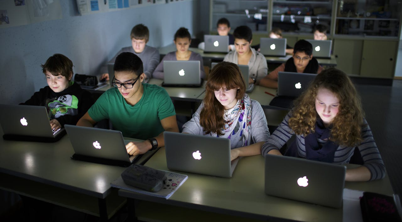 Pupils working at their laptops during a lesson at a German school on November 07, 2012. *Thomas Trutschel/Photothek via Getty Images*. BERLIN, GERMANY – NOVEMBER 07: Pupils working at their lap-tops during a lesson at the Heinrich-Mann-School in the Neukoelln district of Berlin, Germany on November 07, 2012. (Photo by Thomas Trutschel/Photothek via Getty Images)