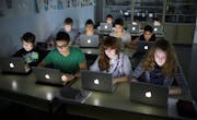 BERLIN, GERMANY – NOVEMBER 07: Pupils working at their lap-tops during a lesson at the Heinrich-Mann-School in the Neukoelln district of Berlin, Germany on November 07, 2012. (Photo by Thomas Trutschel/Photothek via Getty Images)