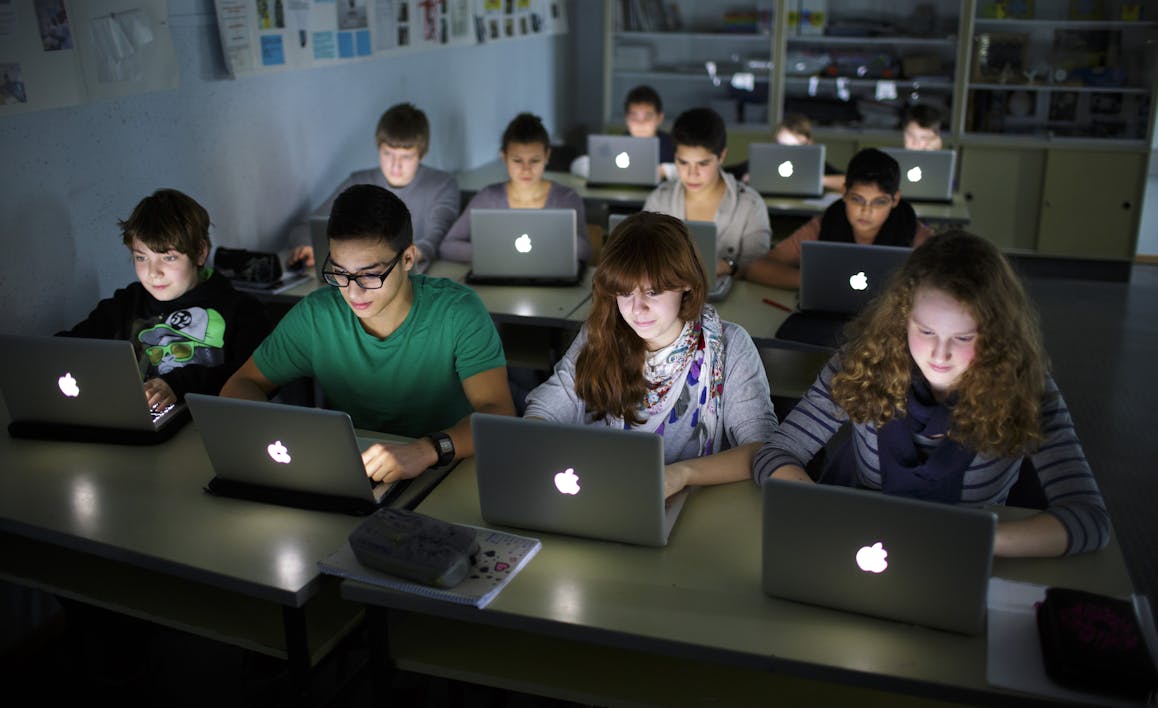 BERLIN, GERMANY – NOVEMBER 07: Pupils working at their lap-tops during a lesson at the Heinrich-Mann-School in the Neukoelln district of Berlin, Germany on November 07, 2012. (Photo by Thomas Trutschel/Photothek via Getty Images)