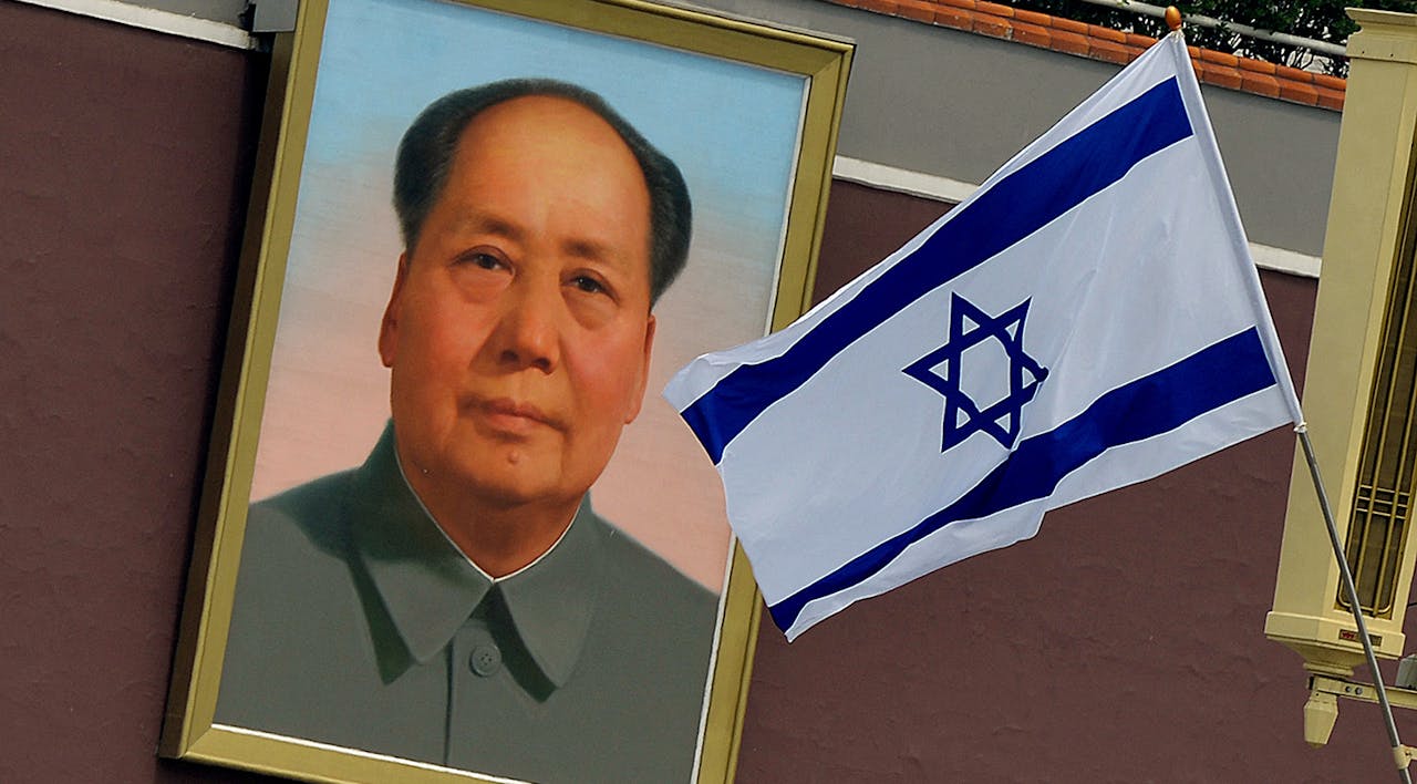 The Israeli flag flies beside a portrait of Mao Zedong at Tiananmen Gate in Beijing on May 8, 2013. *MARK RALSTON/AFP via Getty Images.* Orion China Essay Main