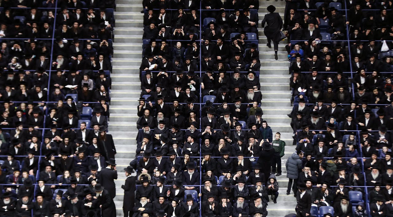 Thousands of haredi Jews gather at Arthur Ashe Stadium in Queens, New York to raise donations for educational institutions in Israel on April 12, 2019. *Atilgan Ozdil/Anadolu Agency/Getty Images*. Spitzer Essay Main