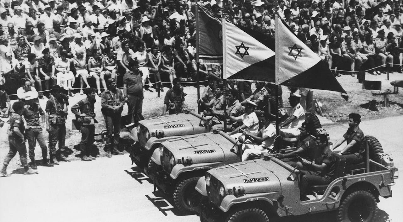 Flag-bearing jeeps at the head of a parade marking the 25th anniversary of the Israeli declaration of independence in Jerusalem on May 8, 1973. *Keystone/Hulton Archive/Getty Images*. Kramer 7 Final Main