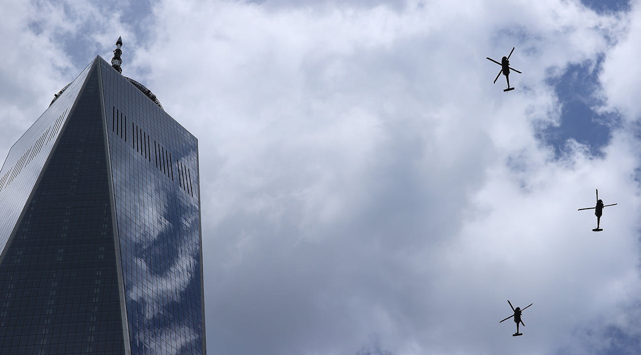 Government helicopters fly past One World Trade Center and the National 9/11 Memorial and Museum on September 11, 2021 in New York City. *Chip Somodevilla/Getty Images*. Goldberg 911 Main