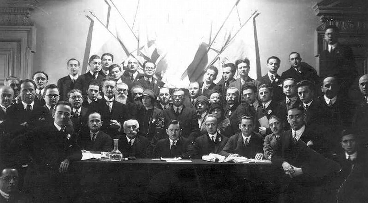 Ze'ev Jabotinsky (second row in the very center, wearing glasses) at a Revisionist Zionist conference likely in Paris in the second half of the 1920s. *Wikipedia.* Jabotinsky Shilon Main