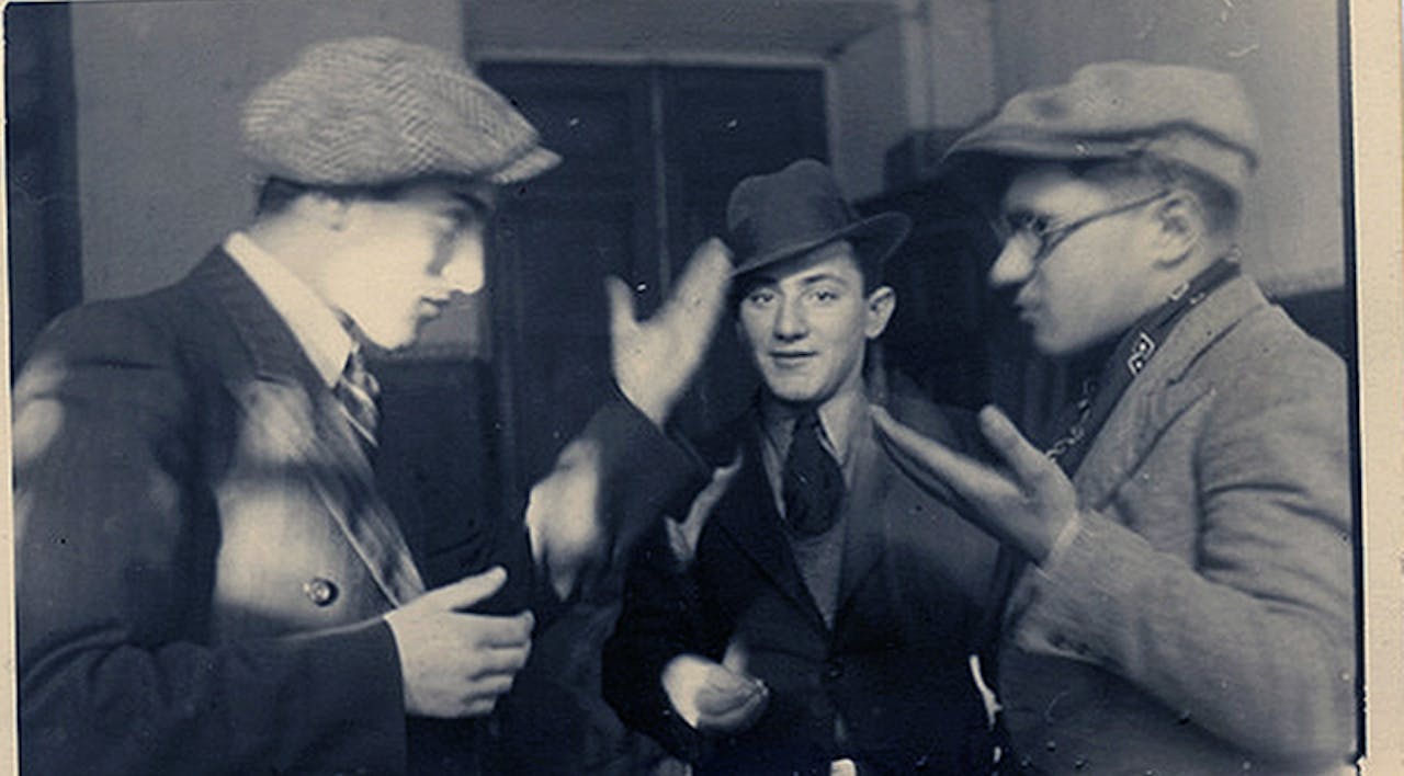 Young Jewish men engaged in a lively talmudic discussion in the Ramayles yeshiva in Vilna in the 1930s. *Taken by A. Sapir, courtesy YIVO.* Wisse Grade Main