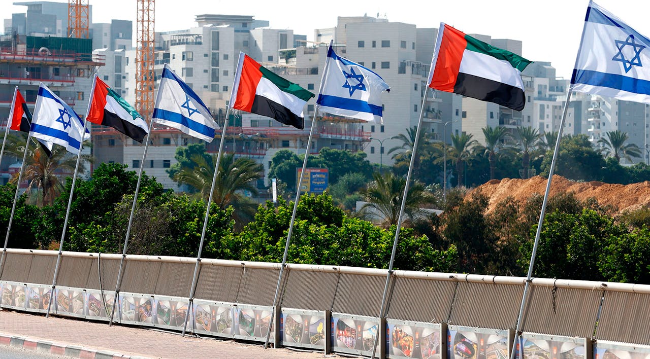 Israeli and United Arab Emirates flags line a road in the Israeli city of Netanya on August 16, 2020. *JACK GUEZ/AFP via Getty Images.* Israel UAE Main