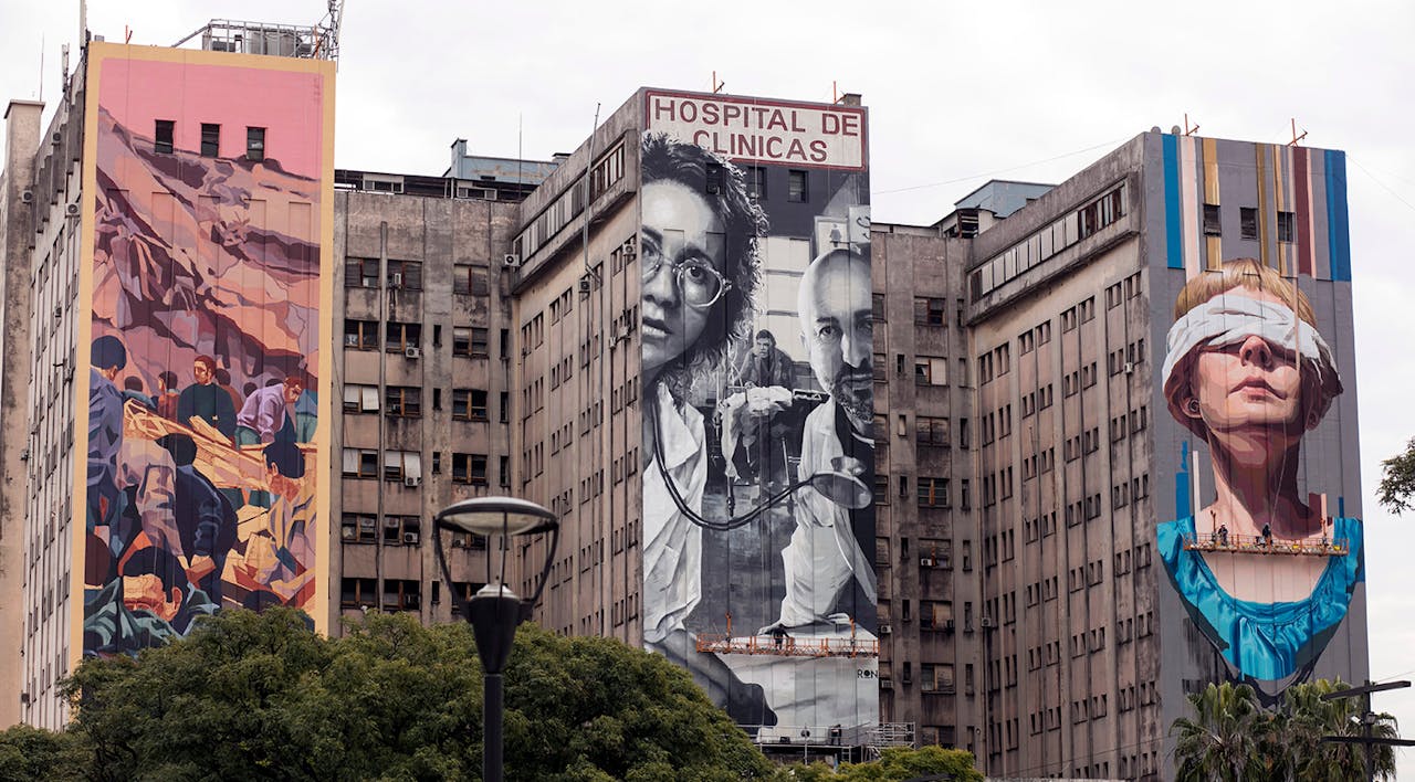 *Three allegorical murals of the victims of the AMIA bombing on the façade **of the Hospital de Clínicas on July 18, 2019 in Buenos Aires, Argentina.* Ricardo Ceppi/Getty Images. AMIA Main