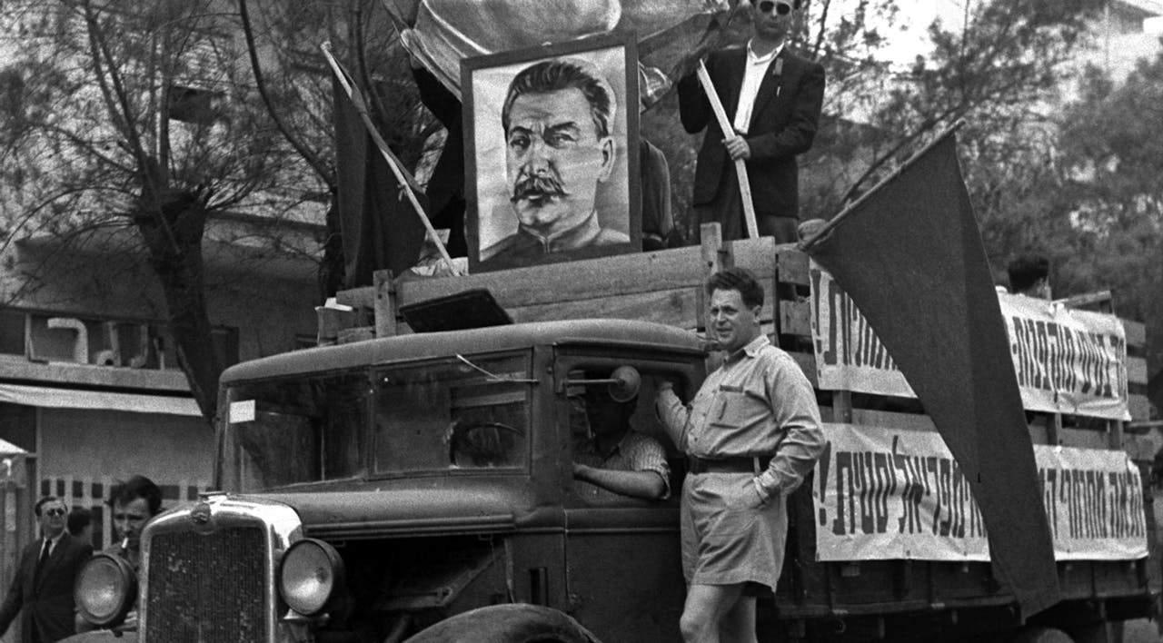 *A truck with the faces of Soviet Communist leaders Lenin and Stalin at the labor day parade held in Tel Aviv on May 1, 1949.* Pinn Hans/Israeli Government Press Office. Stalin-Israel