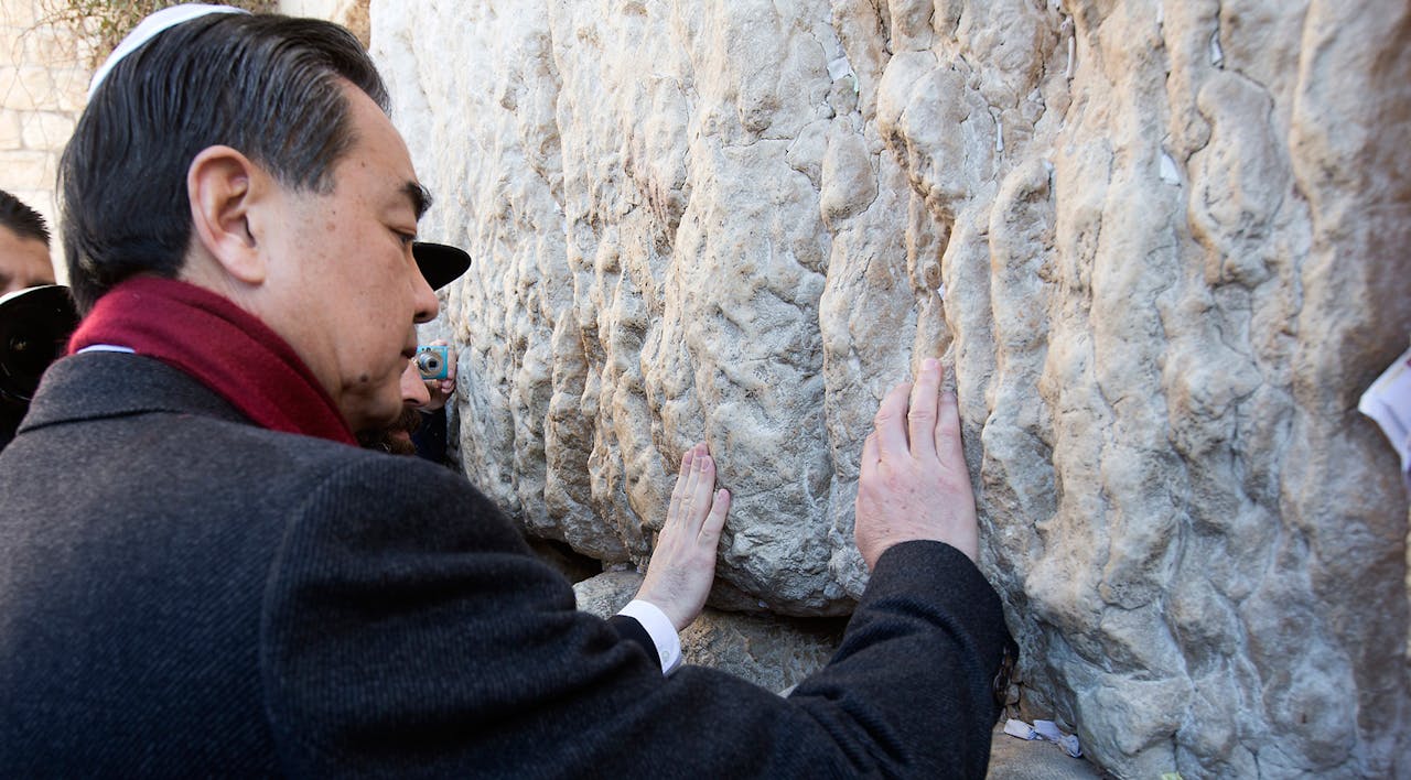 *Chinese Foreign Minister Wang Yi visits the Western Wall in Jerusalem on December 20, 2013.* AHMAD GHARABLI/AFP/Getty Images. China