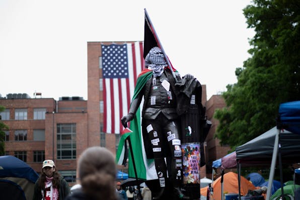 The George Washington statue at George Washington University is vandalized with Palestinian paraphernalia. *Image via Shutterstock. * washington-pal