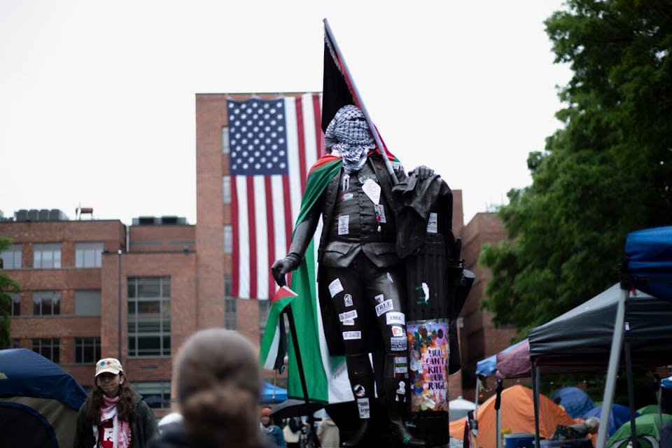 The George Washington statue at George Washington University is vandalized with Palestinian paraphernalia. *Image via Shutterstock. * washington-pal