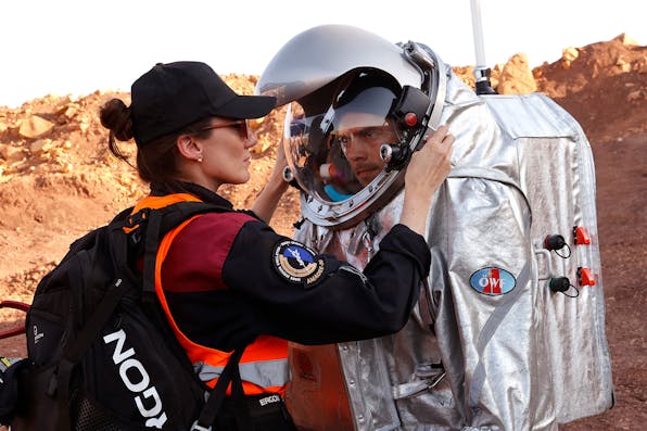 A technician assists an astronaut from a joint European-Israeli team simulating a Mars journey at the Ramon Crater in Israel’s southern Negev desert on October 10, 2021. *JACK GUEZ/AFP via Getty Images*. Space Response
