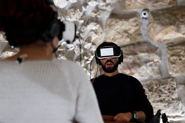 A virtual reality tour of the Second Temple at a visitors center by the Western Wall in Jerusalem on February 23, 2017. *THOMAS COEX / AFP) (Photo by THOMAS COEX/AFP via Getty Images.* Koppel AI LW