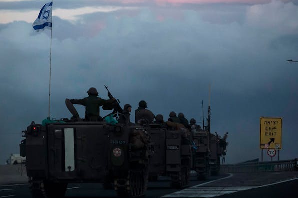 Israeli armored personnel carriers move in formation near the border with Lebanon on October 15, 2023. *Amir Levy/Getty Images*. Schachter Gaza Main