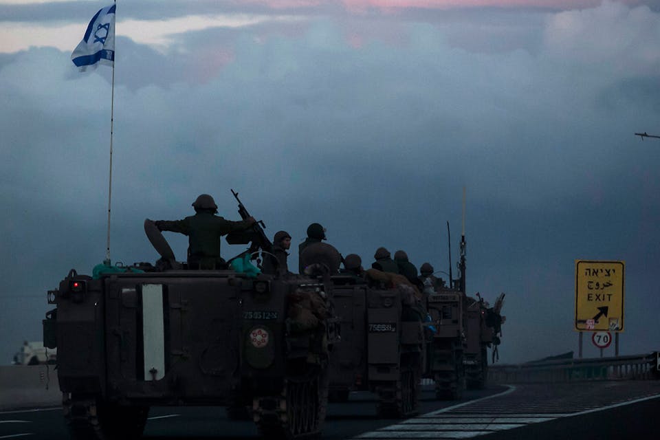 Israeli armored personnel carriers move in formation near the border with Lebanon on October 15, 2023. *Amir Levy/Getty Images*. Schachter Gaza Main