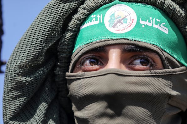 A Palestinian fighter from the armed wing of Hamas in the central Gaza Strip on July 19, 2023. *Majdi Fathi/NurPhoto via Getty Images*. Aboubakr Hamas Main