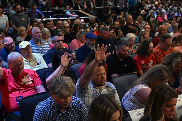 Attendees pray at Eternity Church in Clive, Iowa, on May 30, 2023. *ANDREW CABALLERO-REYNOLDS/AFP via Getty Images.* Carney Main