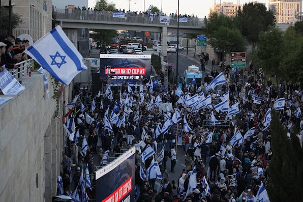 Right-wing pro-reform protestors outside the Knesset in Jerusalem on March 27, 2023. *Saeed Qaq/Anadolu Agency via Getty Images.* Barak-Corren Main