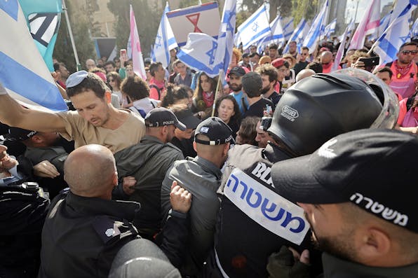Police and protesters outside the Knesset in Jerusalem on March 27, 2023. *Mostafa Alkharouf/Anadolu Agency via Getty Images.* Gordon LW Main