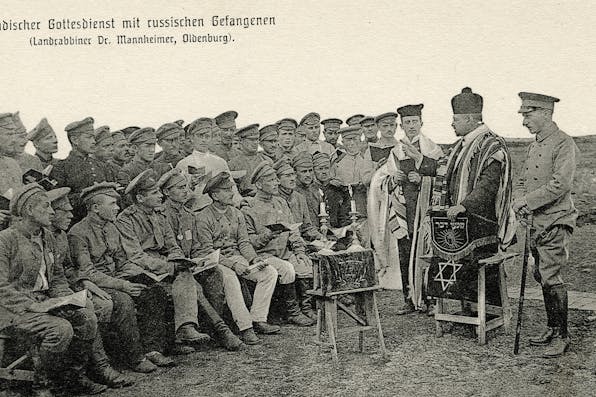 A German rabbi leads religious services for Russian Jewish POWs during World War I. *Universal History Archive/Universal Images Group via Getty Images*. Arkush Koss