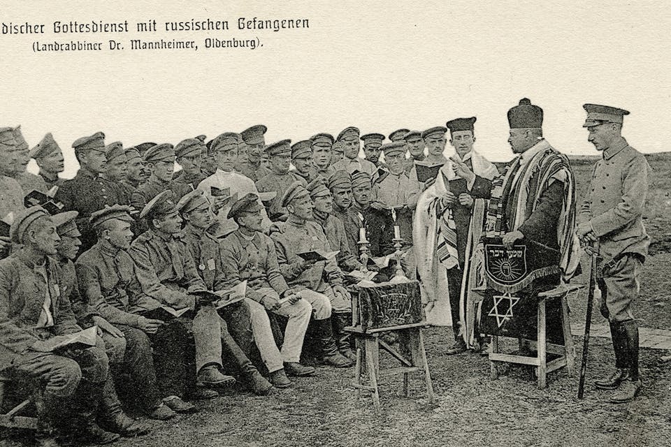 A German rabbi leads religious services for Russian Jewish POWs during World War I. *Universal History Archive/Universal Images Group via Getty Images*. Arkush Koss