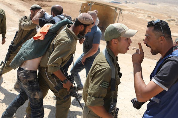 Palestinians and international activists clash with Israeli soldiers following a protest against Israeli military exercises in Masafer Yatta, south of the West Bank city of Hebron, on June 22, 2022. *Mamoun Wazwaz/Xinhua via Getty Images*. Gordon Settlements Main