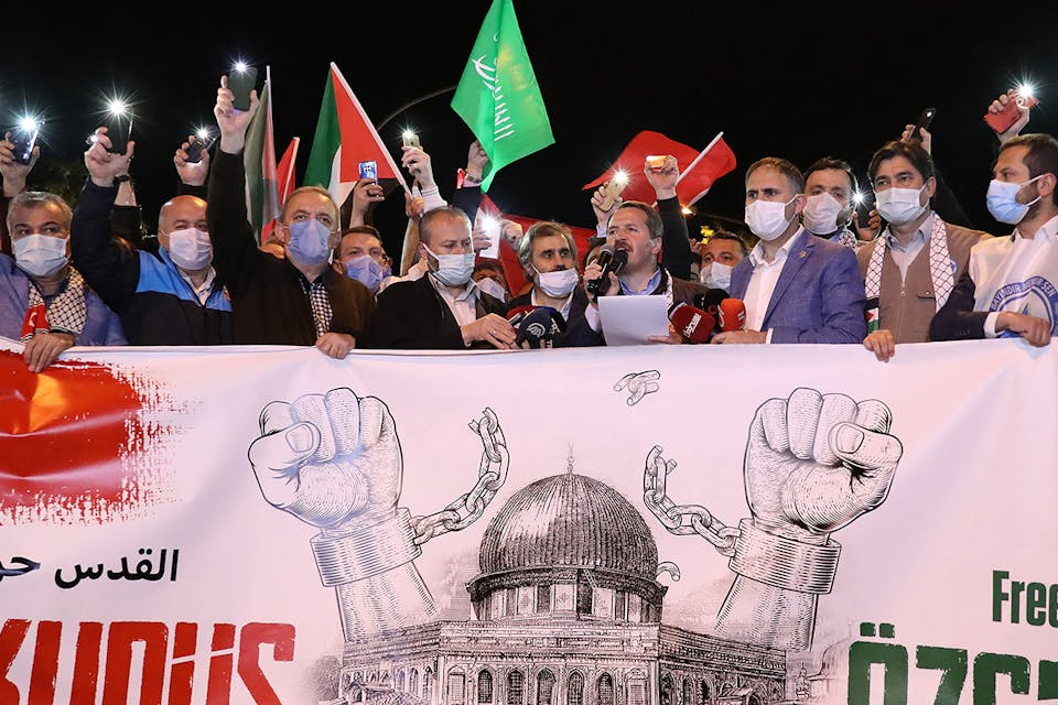 Protesters hold Palestinian and Turkish flags and chant slogans during a demonstration outside the Israeli consulate in Istanbul on May 10, 2021. *ADEM ALTAN/AFP via Getty Images.* Turkey Schanzer