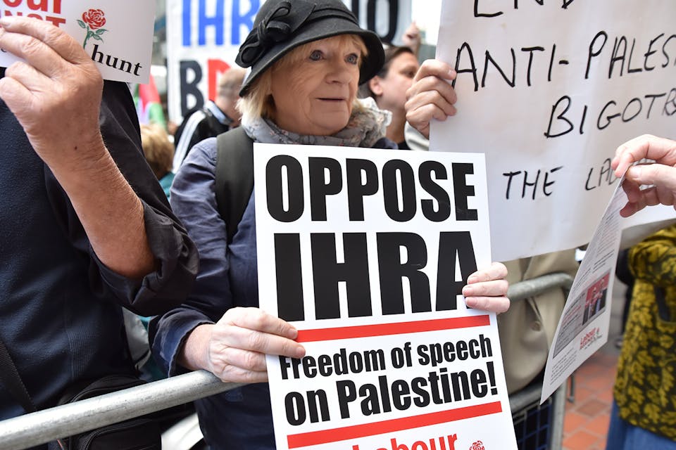 A protest against proposed changes to the IHRA definition of anti-Semitism takes place outside the UK Labor party’s headquarters. *Getty.* IHRA LW