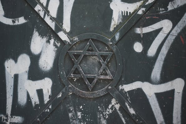 The Star of David surrounded by graffiti on an iron door in Krakow on April 8, 2020. *Artur Widak/NurPhoto via Getty Images*. Cohen IHRA