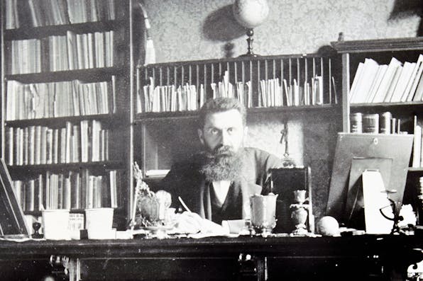 Theodor Herzl at his desk in Vienna around 1900. *Imagno/Getty Images*. Herzl LW Main